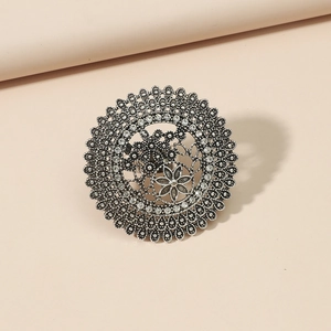 Vintage boho silver hollow round ring with floral pattern and sparkling rhinestones