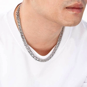 Polished silver curb chain necklace shown worn on a model with white t-shirt detail