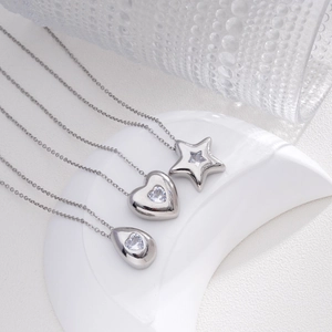 Minimalist titanium steel heart and star pendant necklace set with clear zircon accents