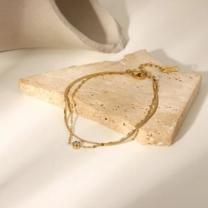 Bracciale a doppio strato in acciaio inossidabile dorato con pendente in zircone