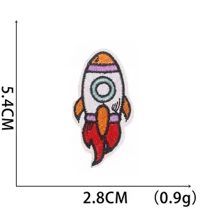 Cartoon rocket ship embroidered patch for clothing with dimensions 5.4cm by 2.8cm