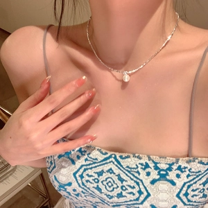 Elegant silver choker necklace featuring a lustrous round white pearl on a minimalist chain