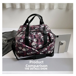Detail view of large travel bag with purple rose and skull print and metal side zipper