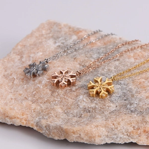 Elegant snowflake pendant necklace available in silver gold and rose gold finishes