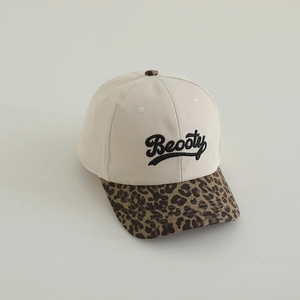 Detailed close-up of leopard print brim and Beooty embroidery on a kids baseball cap