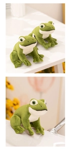 Detailed close-up of a sitting green frog plush toy with soft texture and vivid eyes