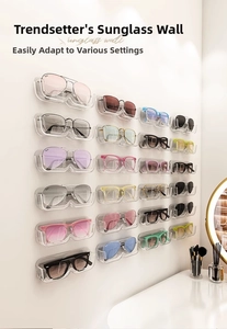Detail showing a wall-mounted acrylic sunglasses organizer wall with wavy U-shaped slots