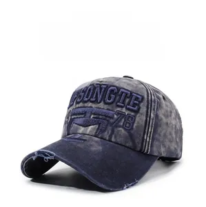 Detailed close-up of vintage washed navy baseball cap with 3D embroidery and distressed brim