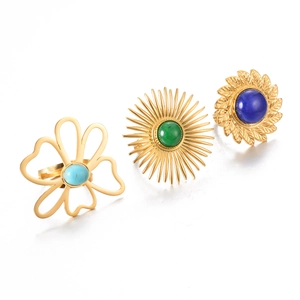 Set of three vintage turquoise stainless steel rings in gold with sunflower patterns