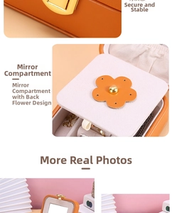 Detail of orange PU leather jewelry box with golden lock and inner mirror compartment