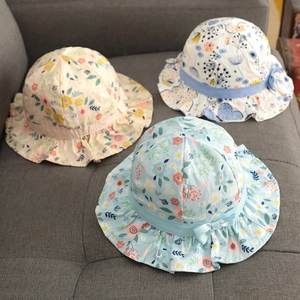 Floral cotton sun hats for baby girls with ruffle edges and delicate bow ribbons