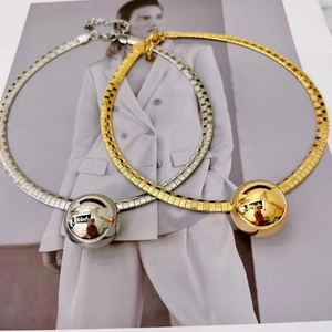Minimalist gold and silver flat weave collar necklaces with polished spherical pendants