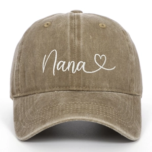 Detail of Nana heart embroidery on vintage washed khaki cotton baseball cap texture