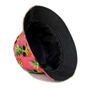 Women's pink bucket hat with pineapple print and sunglasses for summer outdoor sun protection