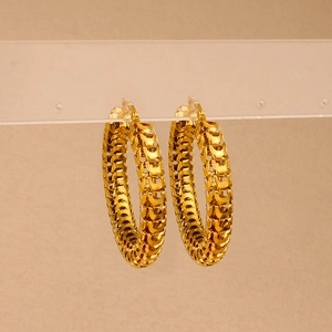 Textured 18K gold plated hollow hoop earrings featuring intricate woven pattern on light background