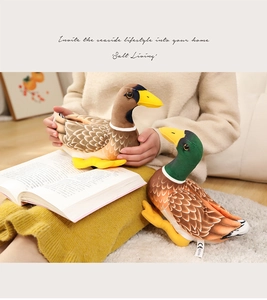 Detail of plush mallard duck toys with soft textures and CE labels on a white rug