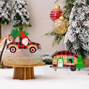 Detailed view of red plaid wooden Christmas gnome car and camper in a snowy scene