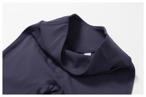 Detailed close-up of high-waist seams and premium fabric on purple yoga flare pants