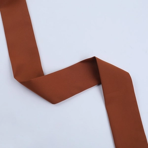 Détail du tissu textile marron rougeâtre de qualité supérieure avec texture de tissage uni