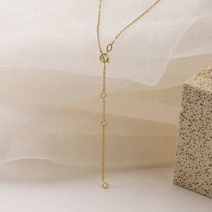 Minimalist gold heart pendant necklace featuring an adjustable extension chain and clasp