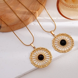 Gold plated stainless steel sunburst pendant necklace with centered gemstone