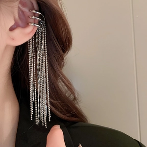 Detail of silver multi-layered ear cuff with cascading tassel chains on ear