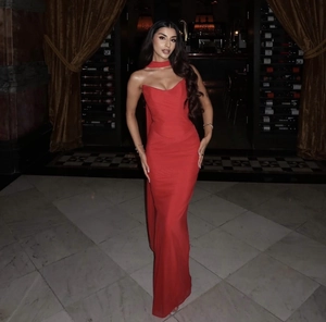 Detail of red tube top dress with matching neck scarf for elegant evening party