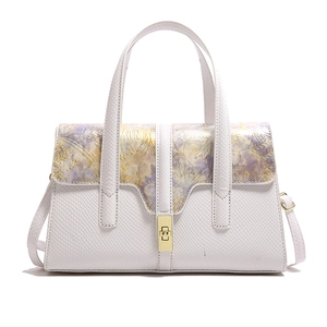White faux lizard leather handbag with purple floral lid and gold twist lock