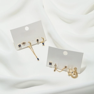 Elegant gold S925 silver earring set with moon, star, and blue zircon pendants