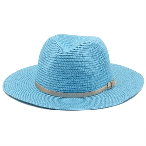 Detailed texture of light blue fedora sun hat with silver faux leather buckle band