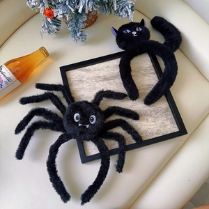 Detail of plush black cat and spider headbands for Halloween party decorations