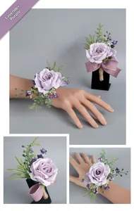Detail view of taro purple silk rose corsage and boutonniere with satin ribbons