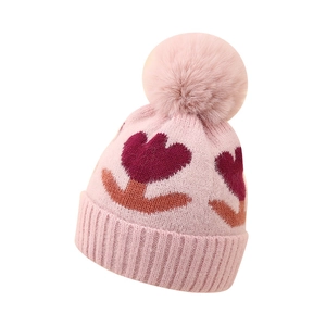Pink winter baby knit hat with large pom-pom and tulip pattern for newborns