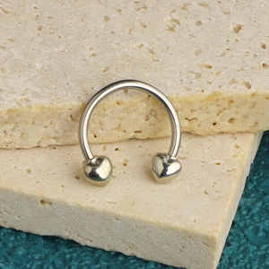 Silver stainless steel U-shaped nose ring with heart accents on textured stones