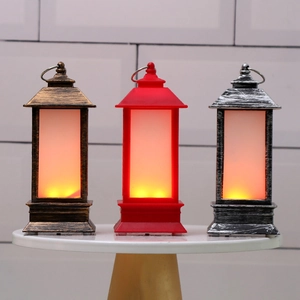 Three LED Christmas lanterns in bronze, red, and silver with warm flickering candle light