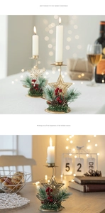 Close-up of golden snowflake candle holder with pine cones and red berries for Christmas decor