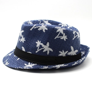 Detail of dark blue Panama straw hat with white coconut tree prints and black band