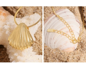 Detailed close-up of a S925 sterling silver shell pendant on a fine gold snake chain