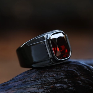 Vintage black stainless steel men's ring featuring a large rectangular red gemstone