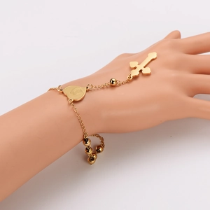 Golden stainless steel cross and heart hand chain bracelet with elegant tassels for women