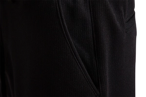 Detail of black leisure pants showing premium honeycomb knit fabric texture and seam stitches