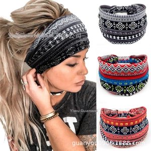 Detail of wide elastic yoga headband featuring bohemian ethnic print and knotted design