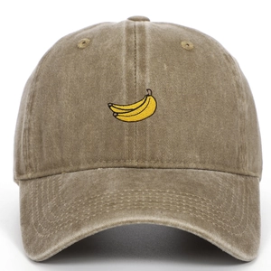 Close-up of embroidered banana pattern on khaki washed cotton baseball cap