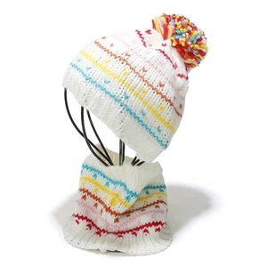 Detail of colorful rainbow striped knit hat and neck warmer set with large multicolor pompom