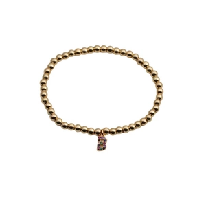 Detail of a gold bead bracelet with a crystal-encrusted letter B pendant and colorful stones