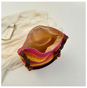 Top view of rainbow straw bucket bag showing interior pocket and wooden bead straps