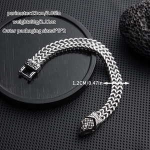 Detail of silver snake head bracelet with dimensions 23cm length and 1.2cm width