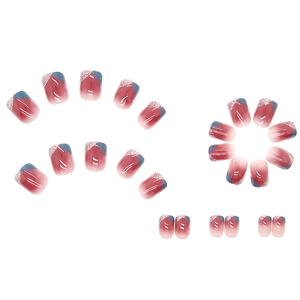 Short square press-on nails set with red ombre gradient and navy glitter accents