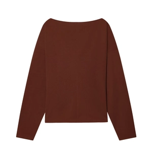 Detail of dark brown off-shoulder knit top with buckle long sleeves and ribbed texture