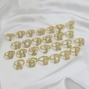 26 gold bubble letter rings set with sparkling cubic zirconia and open adjustable bands